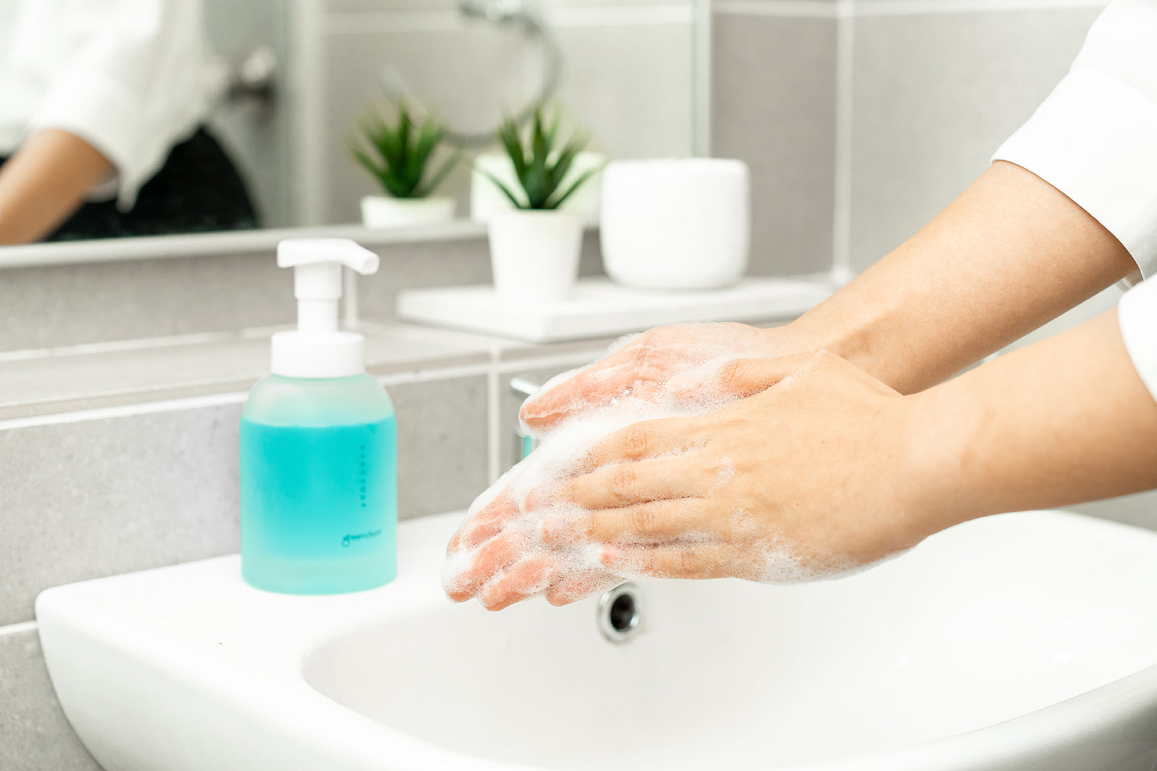 A person thoroughly washing their hands with soap to maintain health and hygiene, a key practice for Malaysian families. Greencleani promotes clean hands for a healthy home